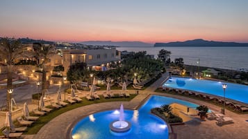 2 outdoor pools, pool loungers, lifeguards on site