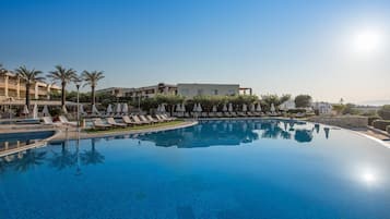 2 outdoor pools, pool loungers, lifeguards on site