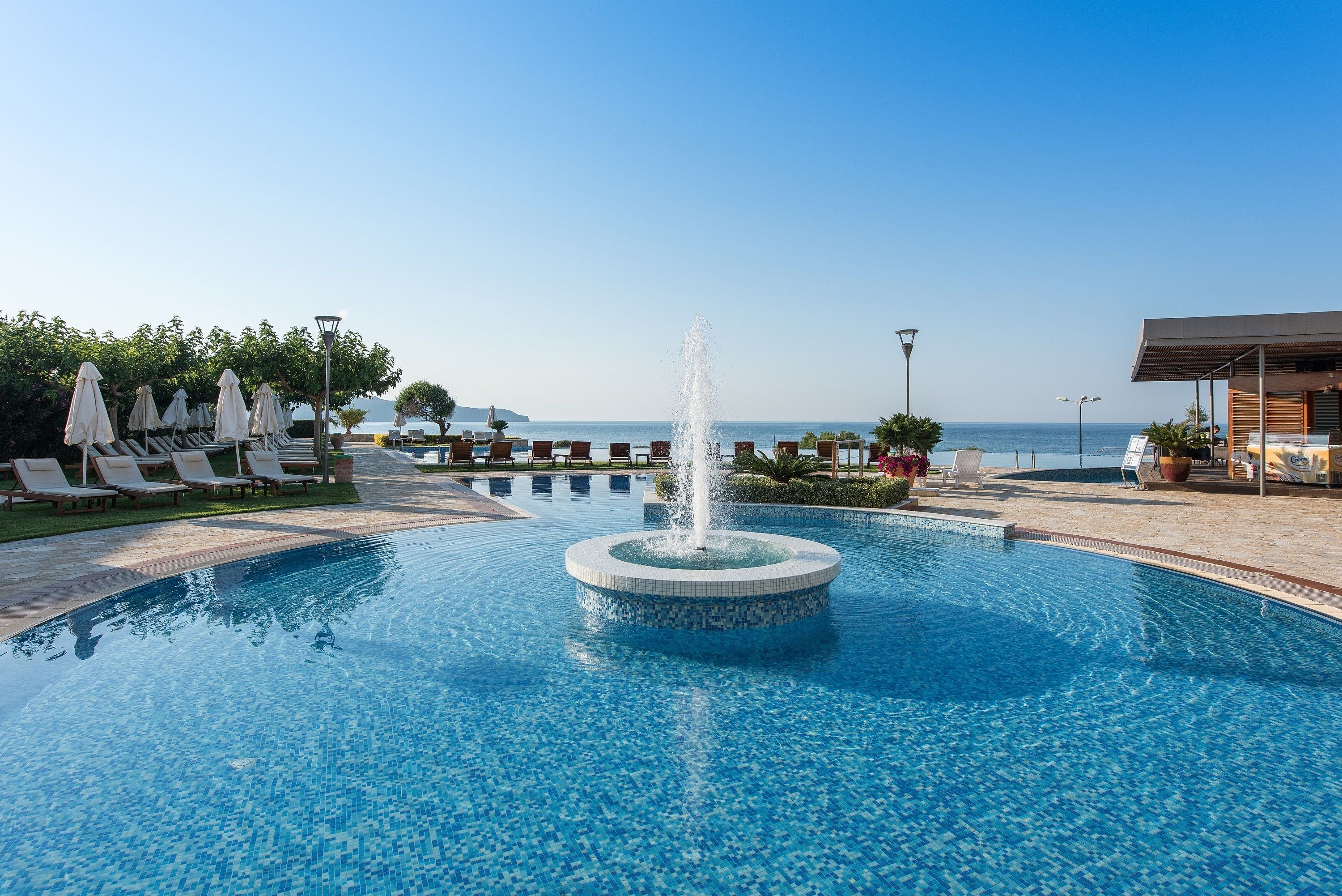 2 outdoor pools, pool loungers, lifeguards on site