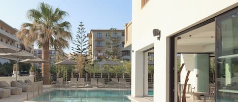 Indoor pool, 2 outdoor pools, open 10:00 AM to 6:00 PM, pool umbrellas