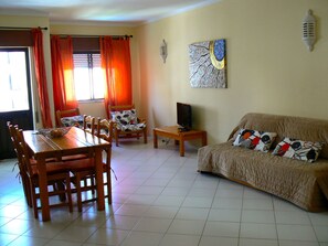 32-inch flat-screen TV with cable channels, TV