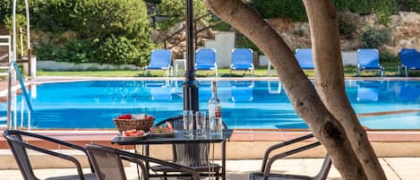 Seasonal outdoor pool, pool umbrellas, pool loungers