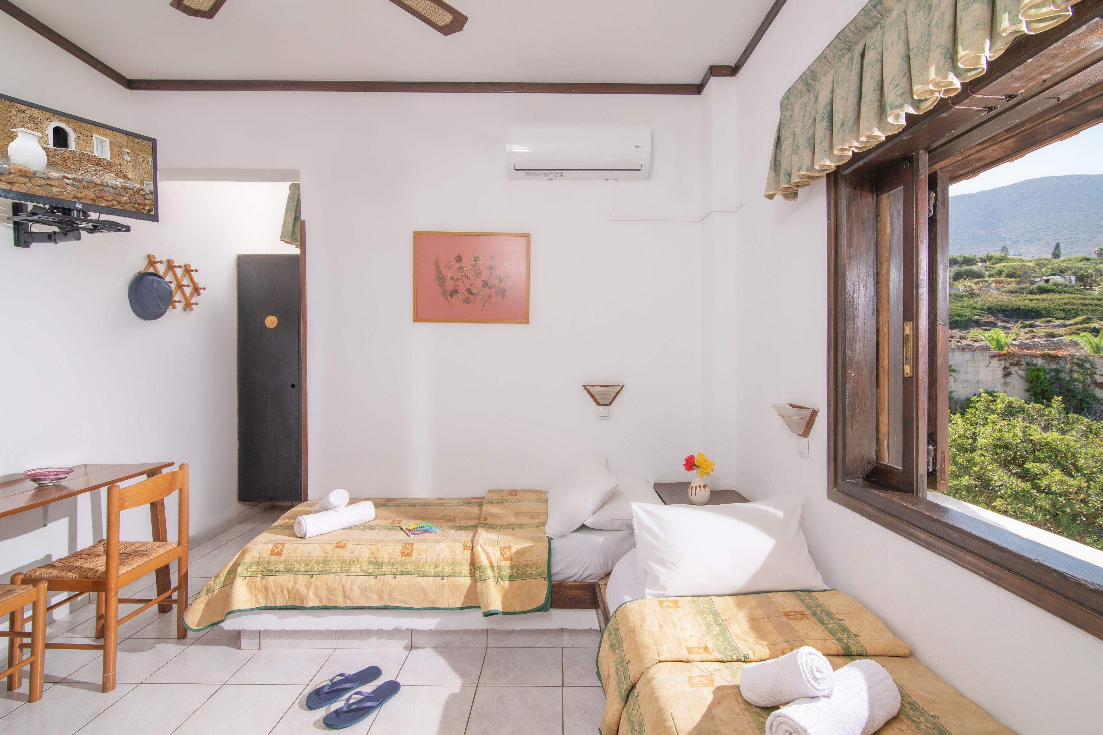 one bedroom apartment with sea view | living area | 14-inch tv with cable channels