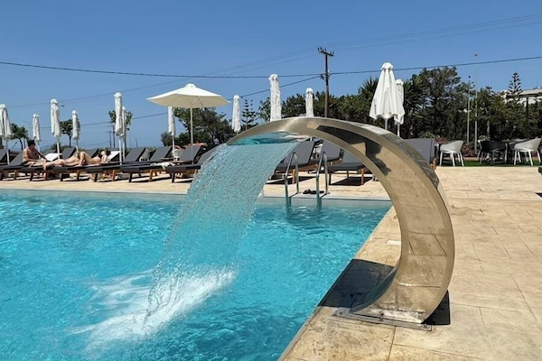 2 outdoor pools, pool umbrellas, sun loungers