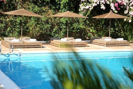 Seasonal outdoor pool, open 10:30 AM to 6 PM, sun loungers