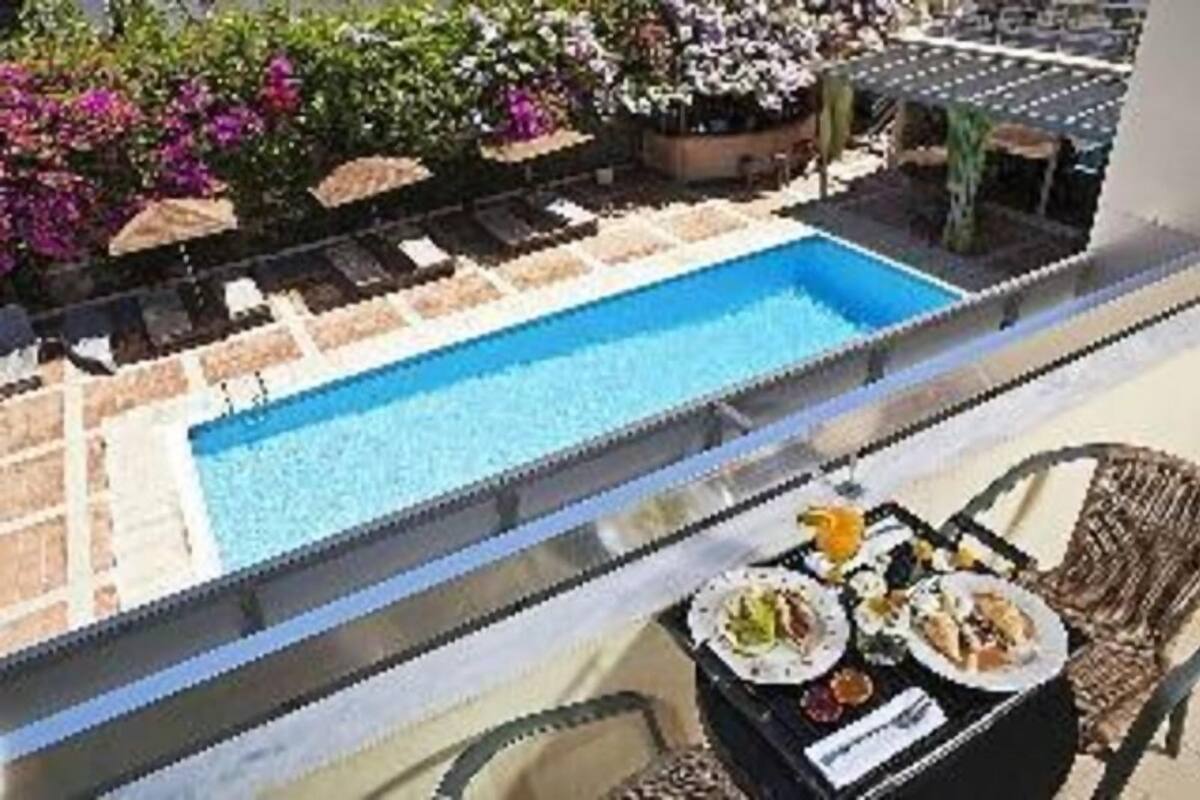 Pool | Seasonal outdoor pool, open 10:30 AM to 6 PM, sun loungers