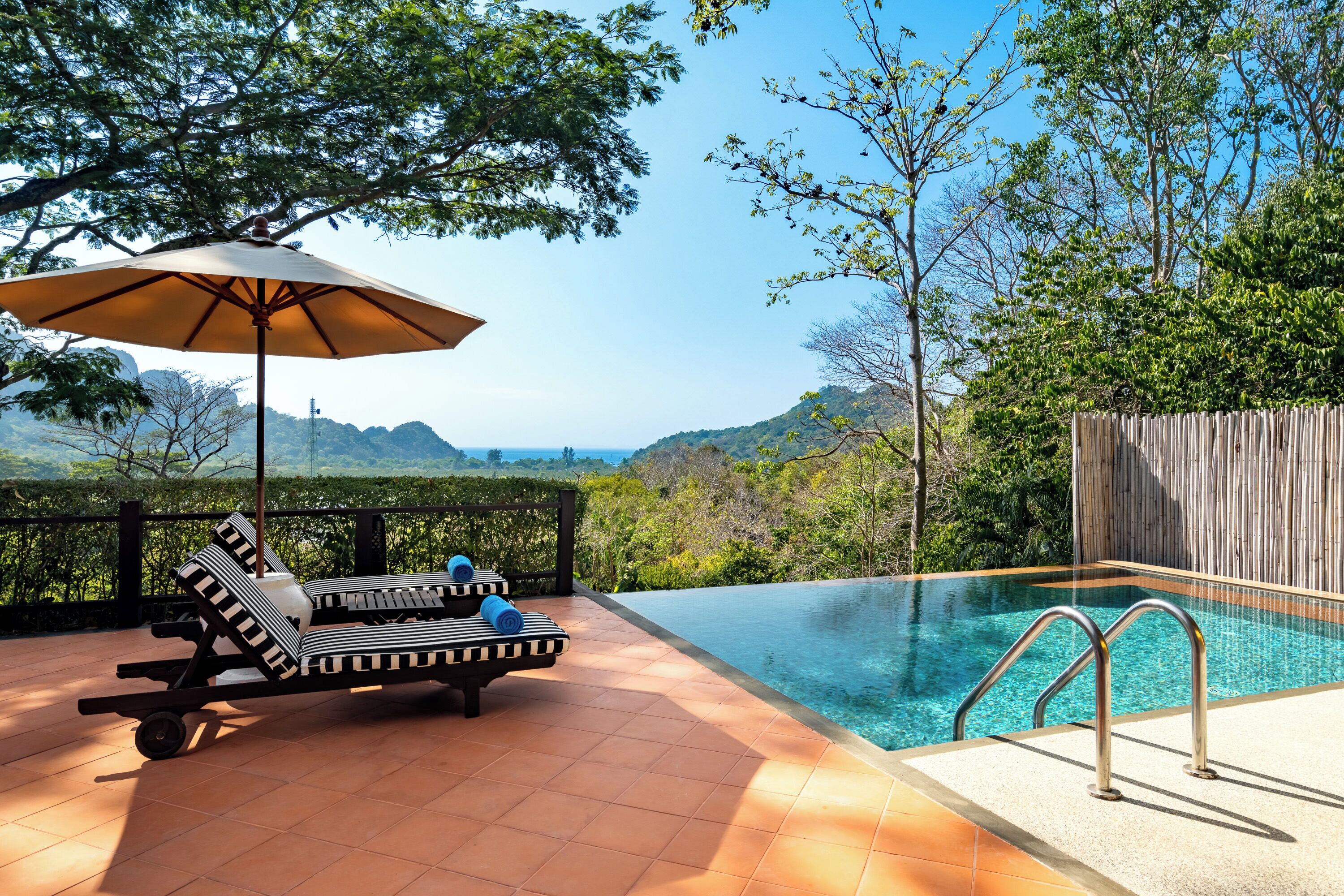 2 outdoor pools, open 7:00 am to 7:00 pm, pool umbrellas, pool loungers