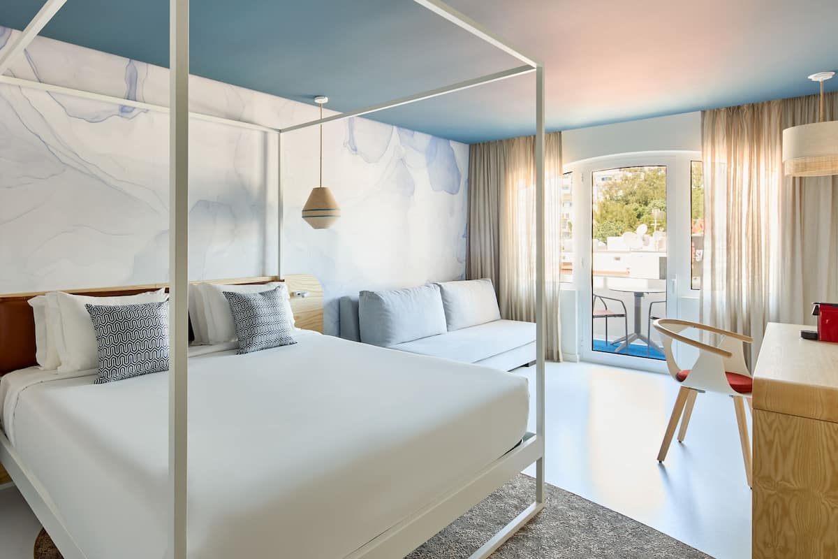 Suite, 1 King Bed, Balcony | 1 bedroom, in-room safe, individually decorated, desk