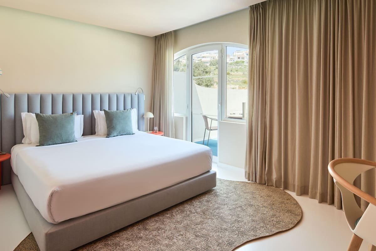 Standard Room, 1 King Bed, Balcony | 1 bedroom, in-room safe, individually decorated, desk