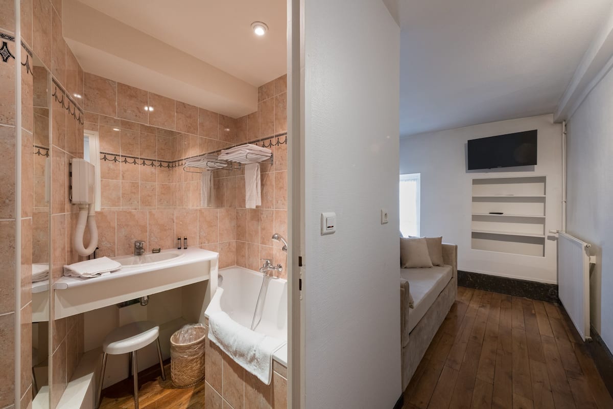 superior quadruple room | bathroom | hair dryer, towels