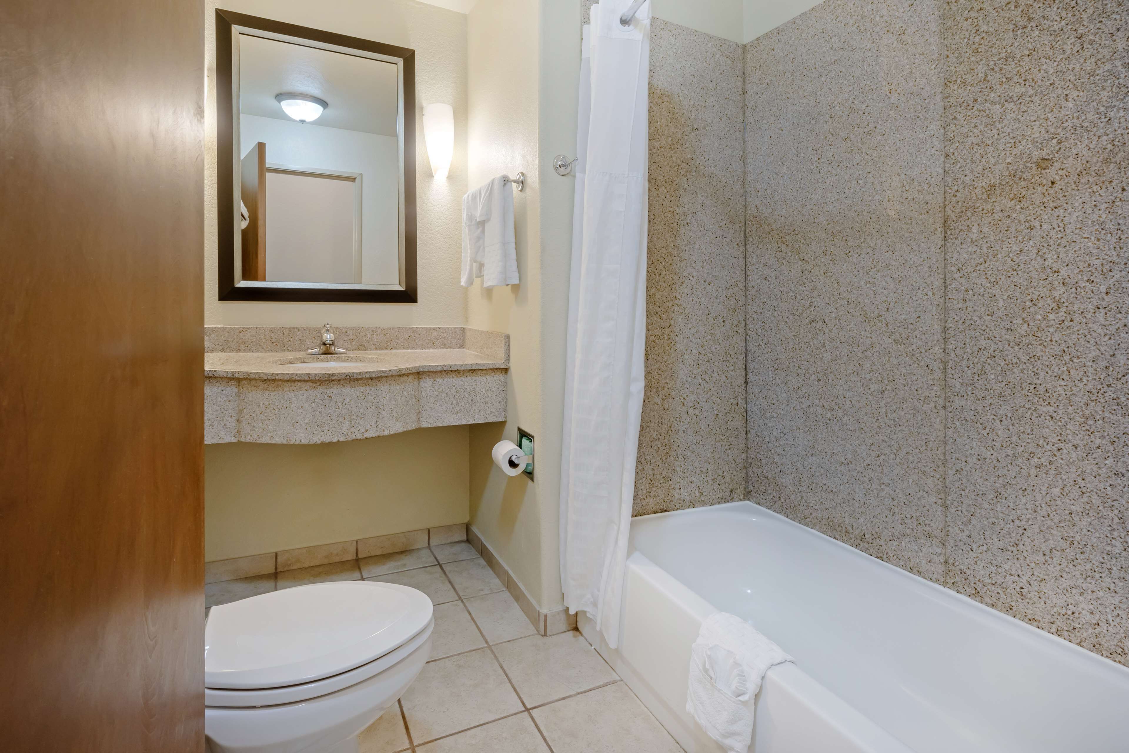suite, 2 queen beds, non smoking, refrigerator & microwave (with single sofabed) | bathroom | free toiletries, hair dryer, towels