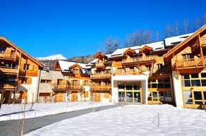 Chalet-style buildings with balconies and communal living areas.