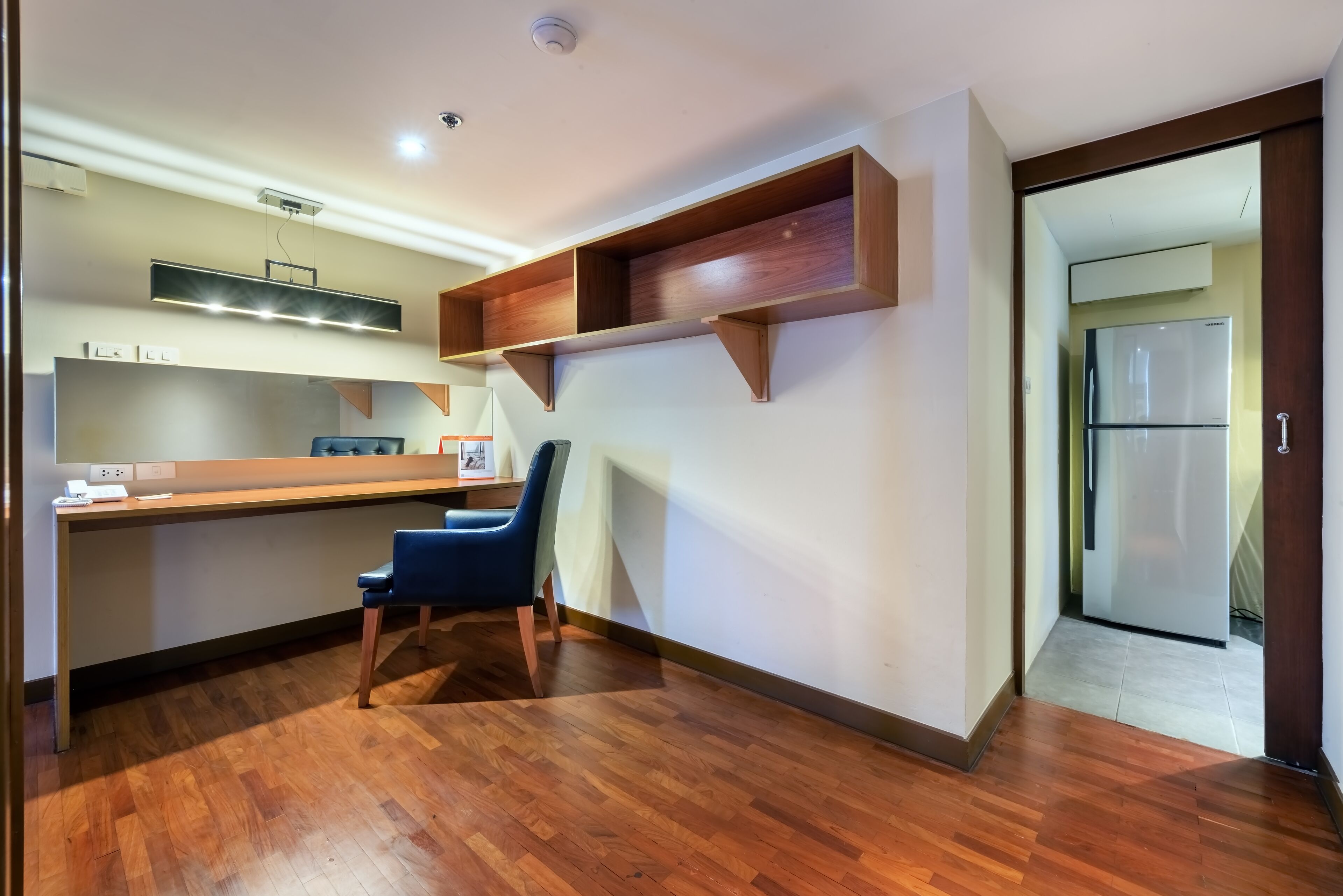 two bedroom residence with balcony | living area | 32-inch smart tv with satellite channels