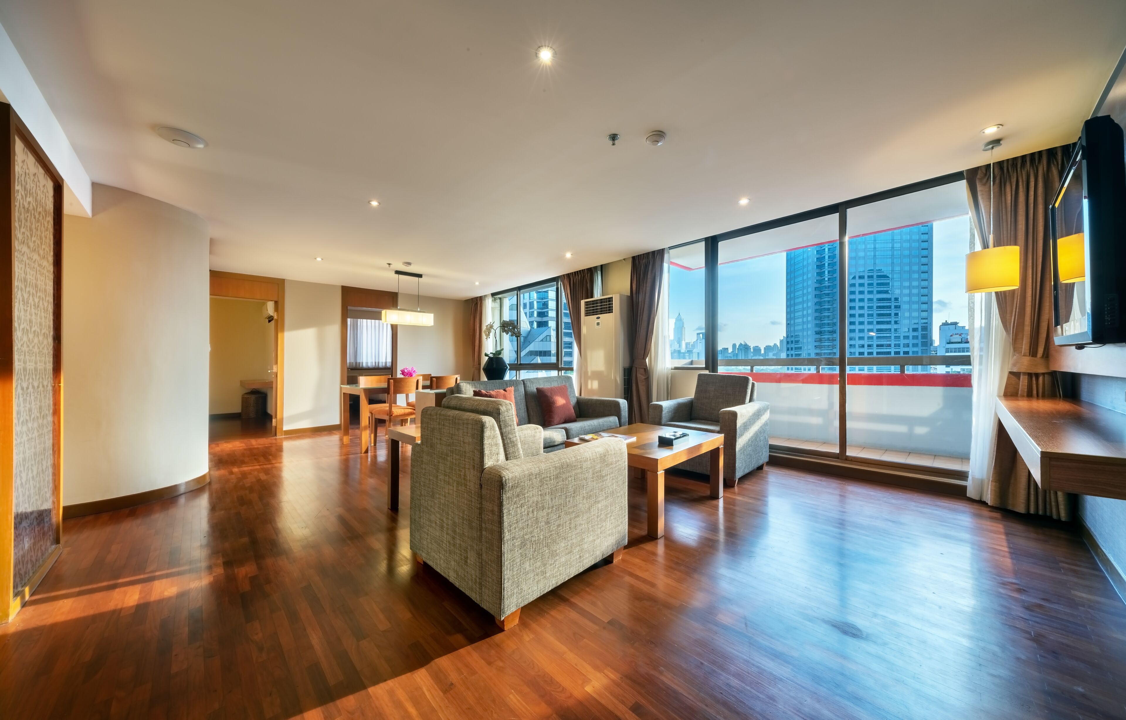 two bedroom residence with balcony | living area | 32-inch smart tv with satellite channels