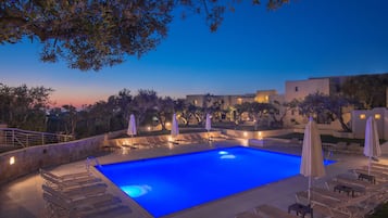 Seasonal outdoor pool, open 9:00 AM to 8 PM, pool umbrellas