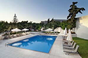 Seasonal outdoor pool, open 9:00 AM to 8 PM, pool umbrellas