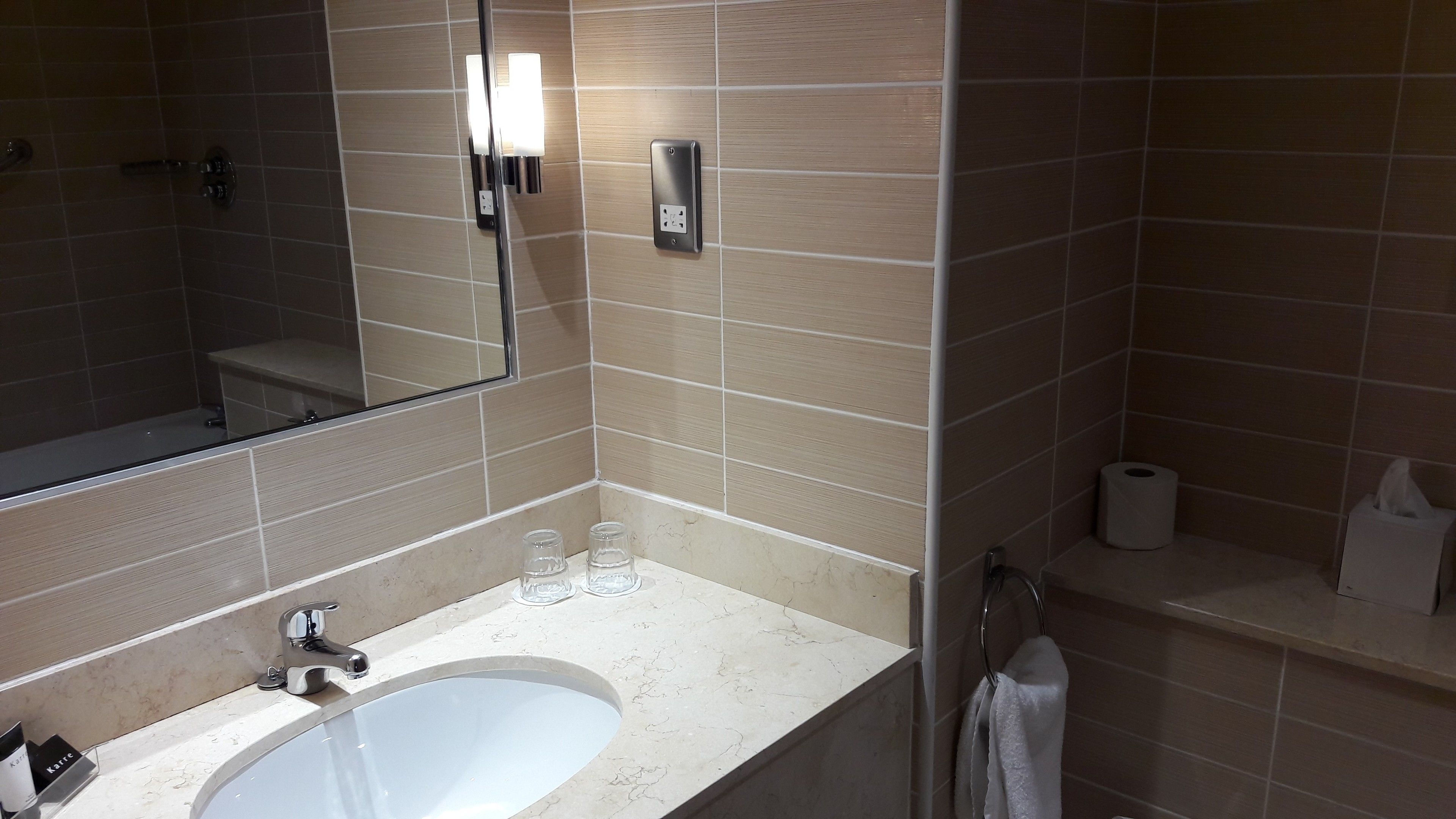 designer toiletries, hair dryer, towels