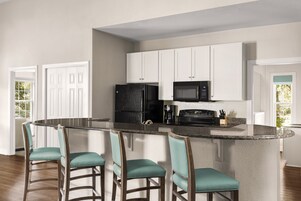 Full-size fridge, microwave, stovetop, dishwasher