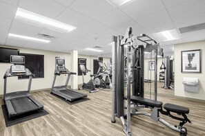 A gym with treadmills, elliptical machines, and weightlifting equipment. - Staybridge Suites Chattanooga at Hamilton Place by IHG (Chattanooga)