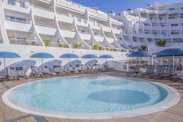 Outdoor pool, a heated pool, pool loungers