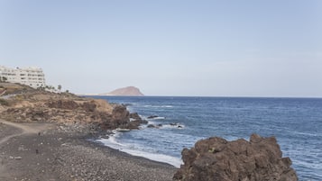 Overlooking the calm sea, this beachfront property offers stunning ocean views.