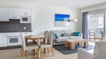 32-inch flat-screen TV with satellite channels, TV