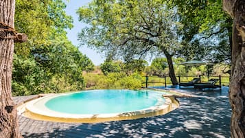 4 outdoor pools, open 7 AM to 5 PM, pool umbrellas, pool loungers