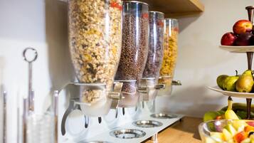 A food dispensing station with multiple containers for different food items.