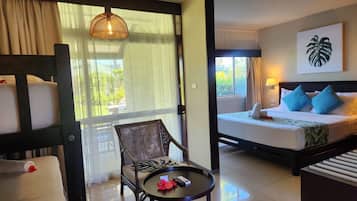 Deluxe Family Room | In-room safe, desk, blackout drapes, iron/ironing board