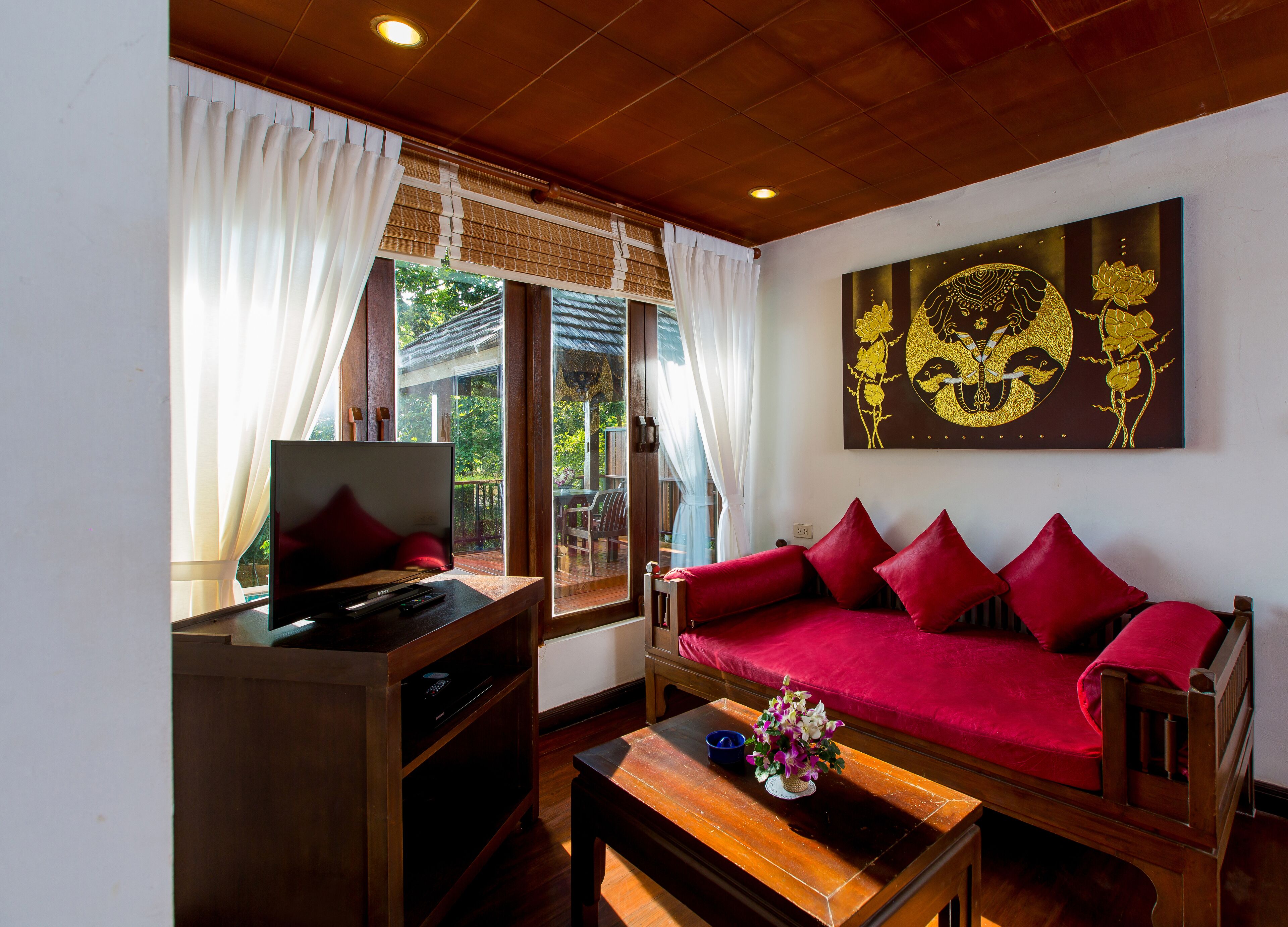 one bedroom pool villa | living area | 32-inch lcd tv with satellite channels, tv, dvd player