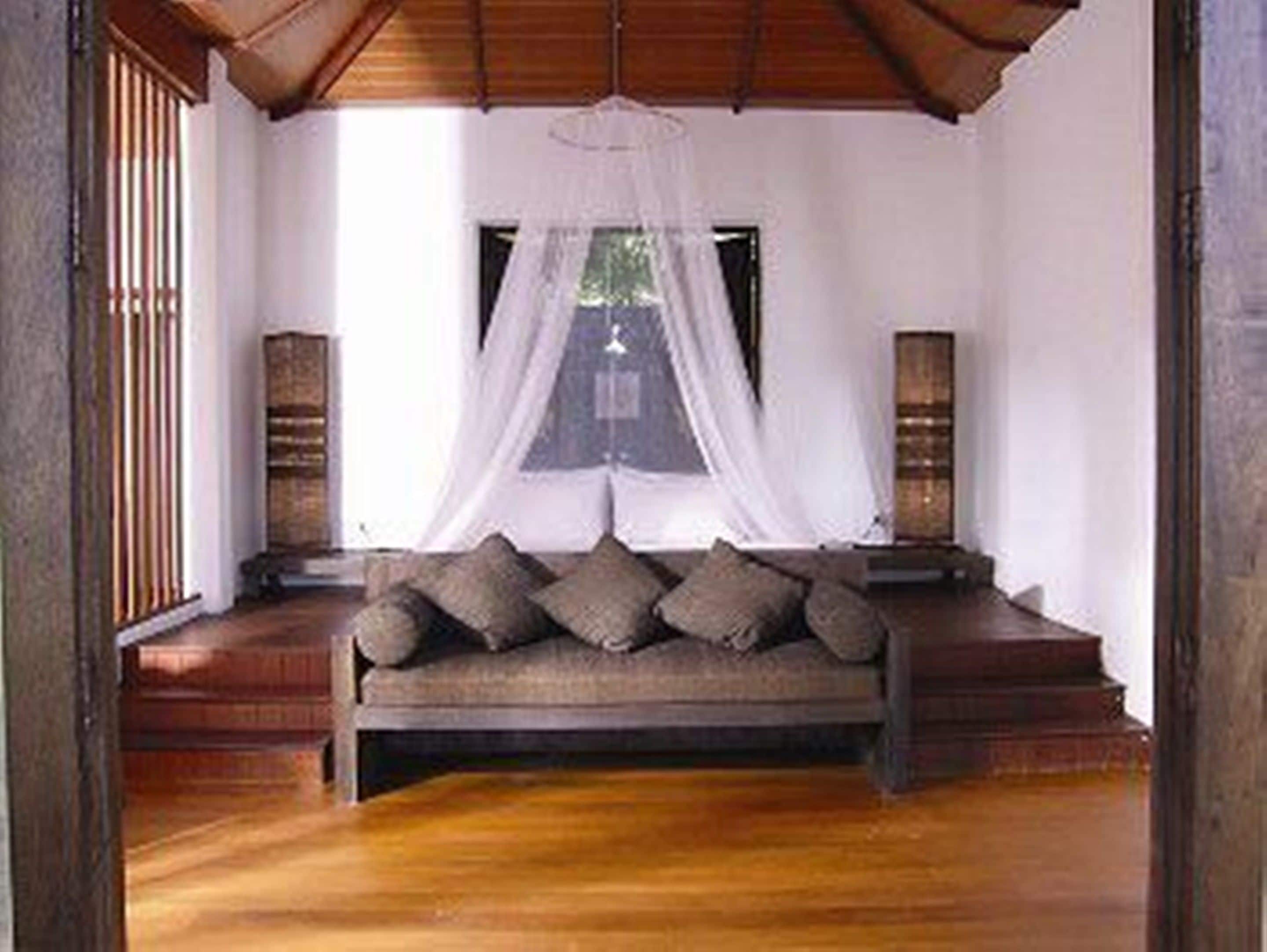 villa, private pool, beachfront | living area | 32-inch lcd tv with satellite channels, tv, dvd player