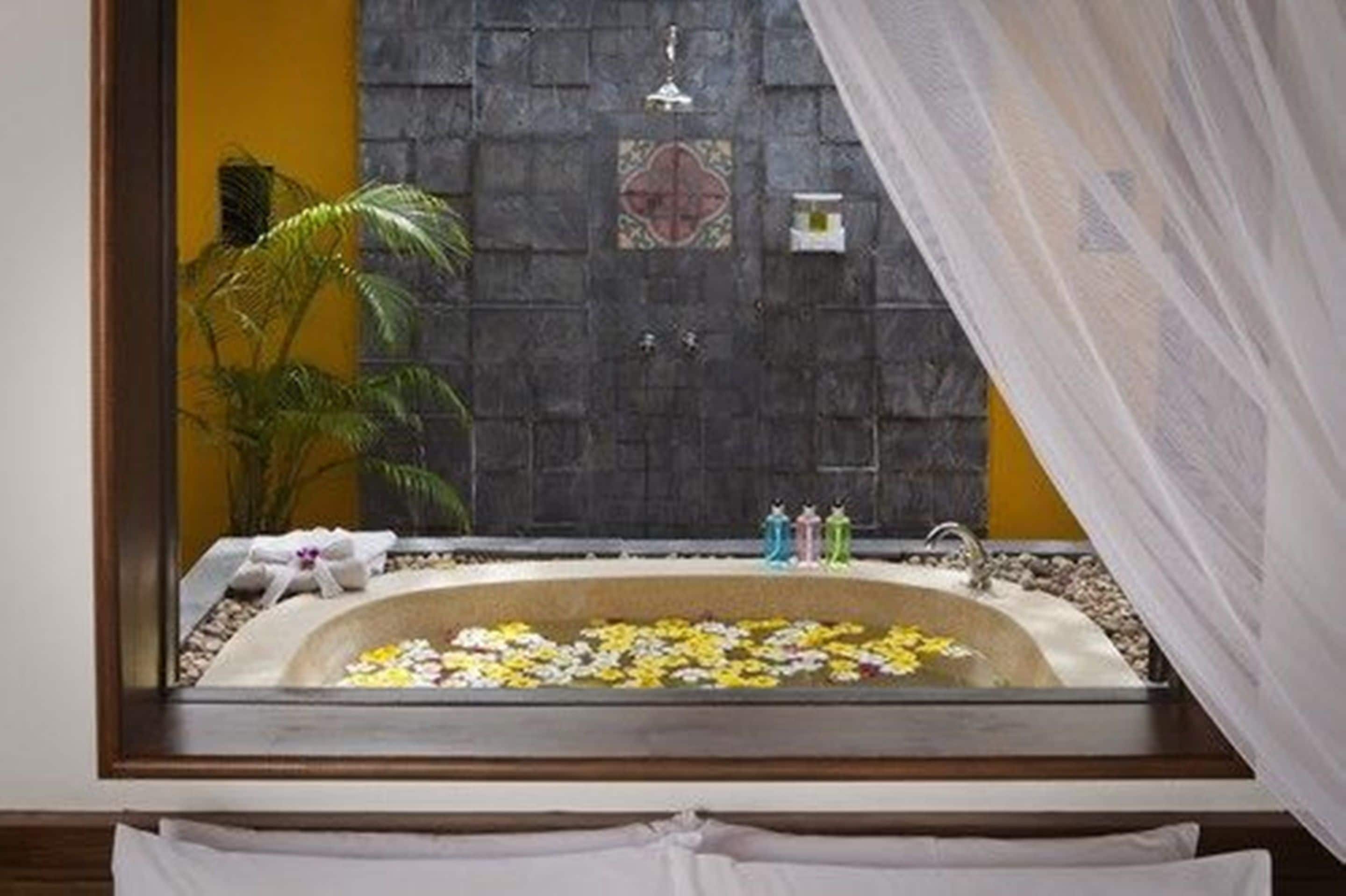 villa, private pool, beachfront | deep-soaking bathtub