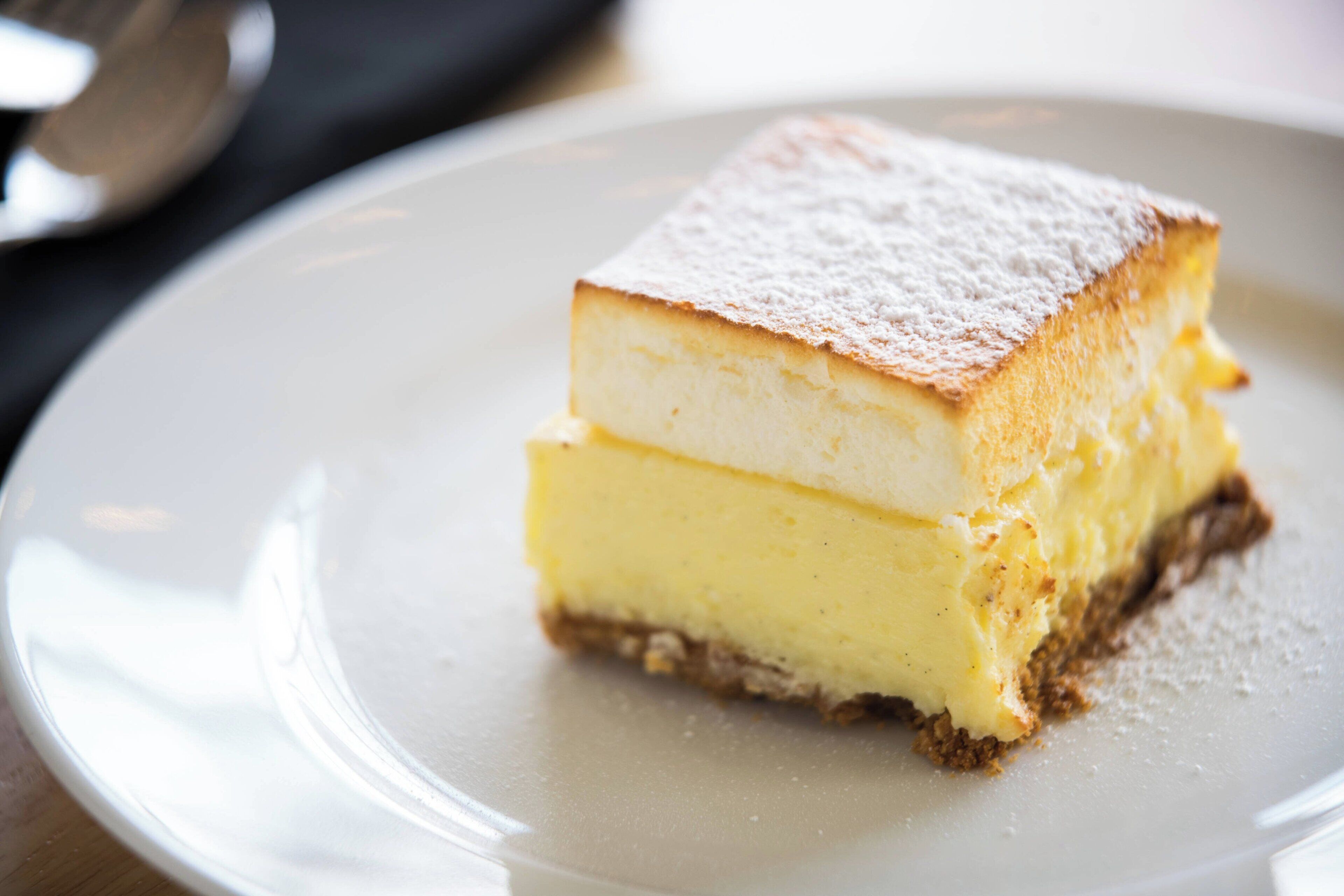 A slice of layered cake on a plate.