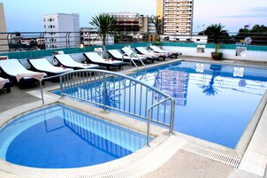 Outdoor pool, open 7:00 AM to 6:00 PM, pool loungers