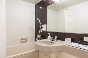 A modern bathroom with a large sink, mirror, and shower. - Comfort Hotel Niigata (Niigata)