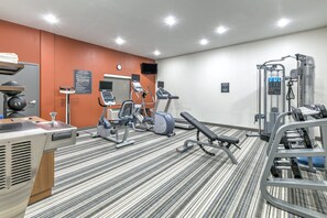 A gym with treadmills, weight machines, and a bench press. - Candlewood Suites Lake Jackson Clute by IHG (Lake Jackson)