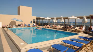 Seasonal outdoor pool, pool umbrellas, sun loungers