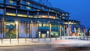 A modern building with a curved facade, large windows, and a prominent entrance. - Radisson RED London Twickenham (Twickenham)
