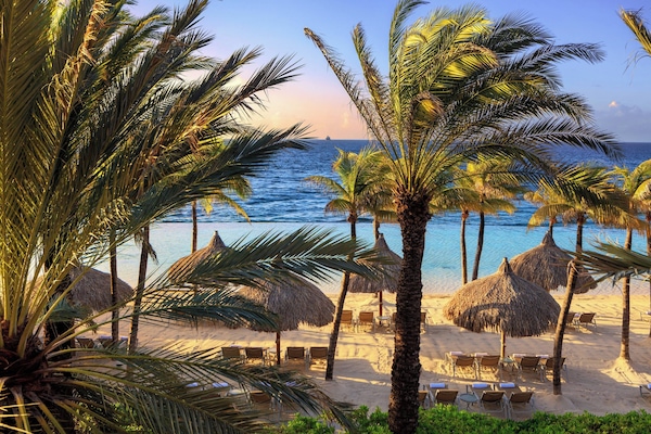 Private beach, white sand, sun loungers, beach umbrellas