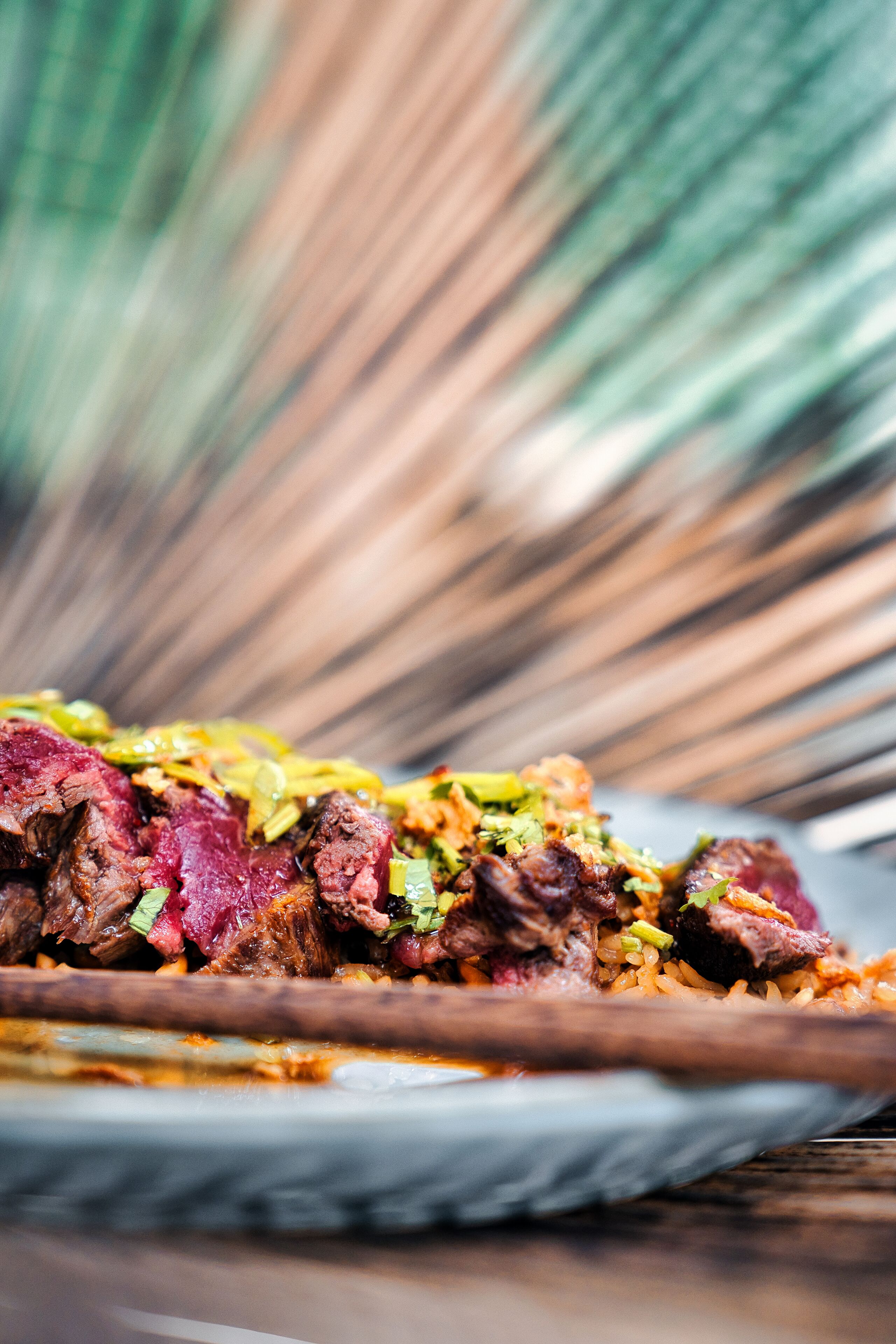 A plate of food with meat and vegetables.