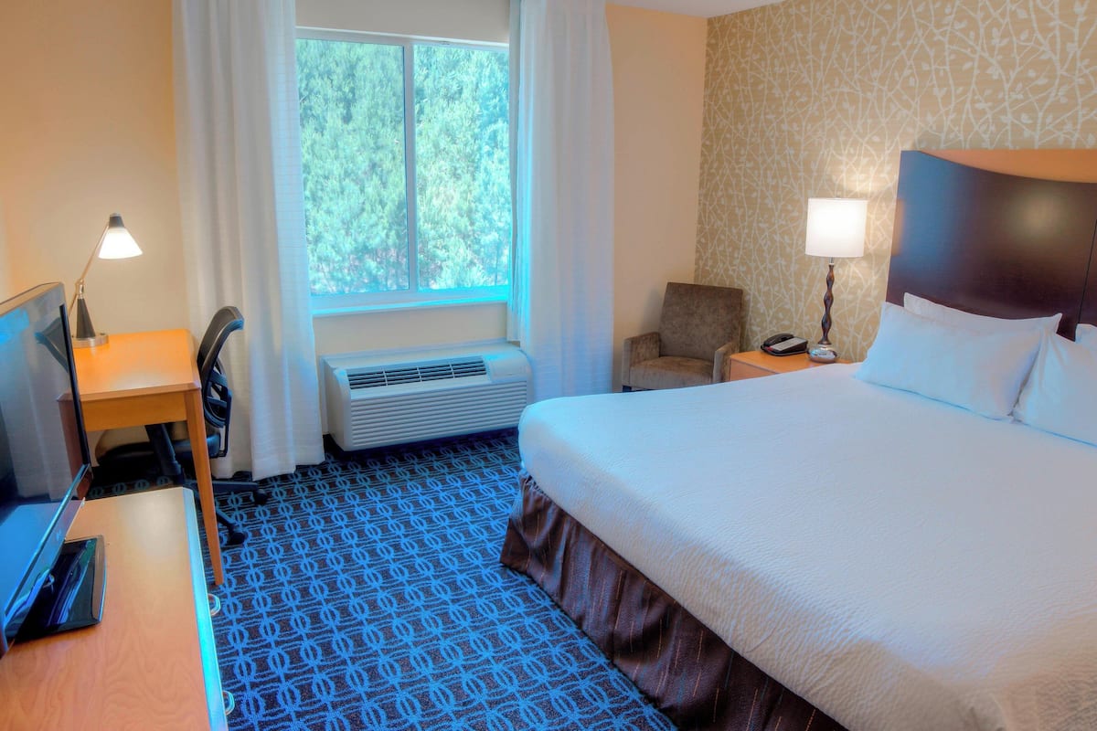 Hypo-allergenic bedding, down duvets, desk, laptop workspace