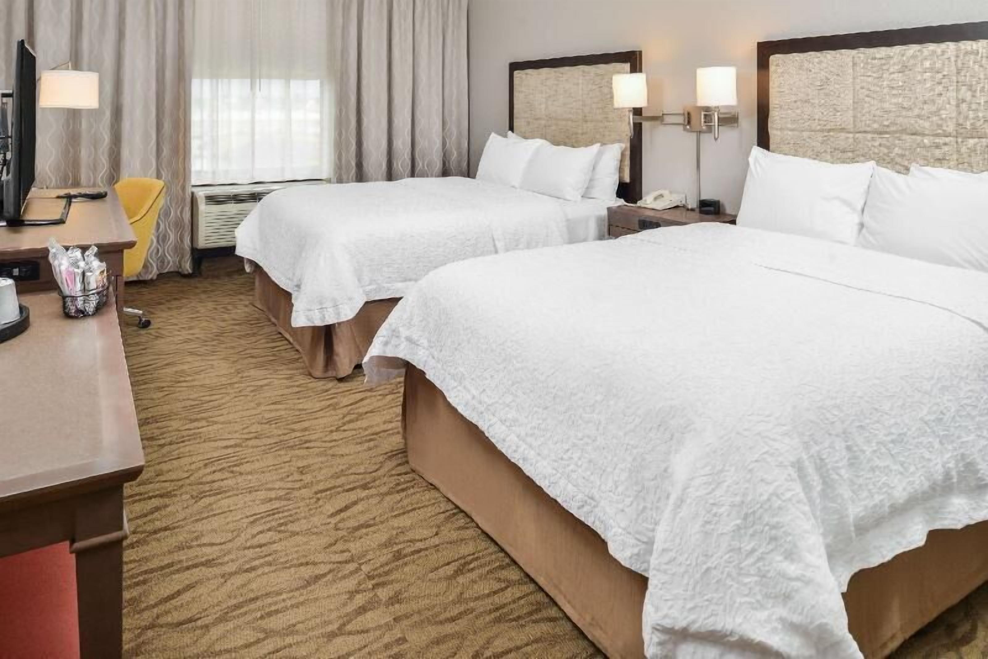 Premium bedding, down comforters, pillowtop beds, laptop workspace