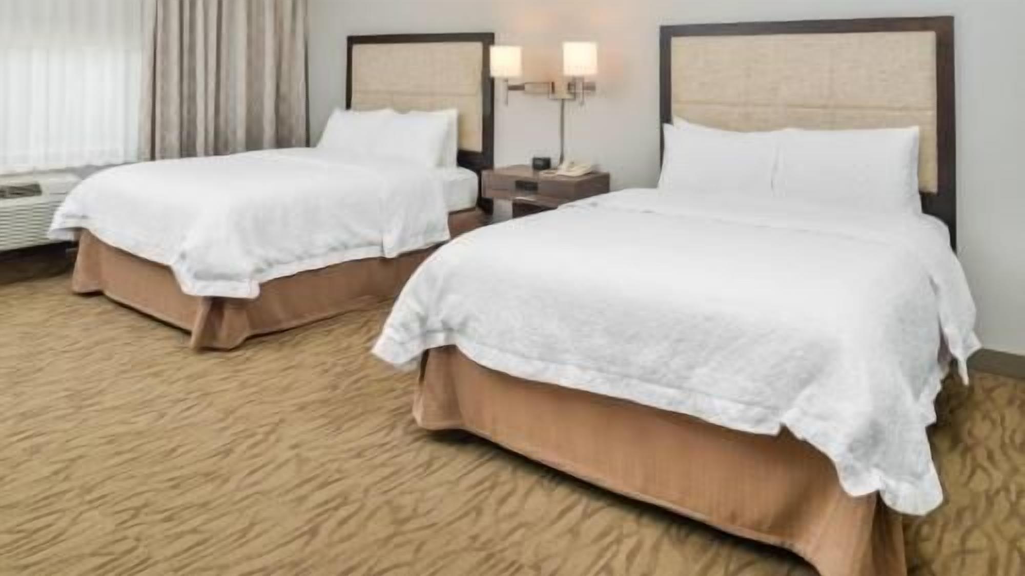Premium bedding, down comforters, pillowtop beds, laptop workspace