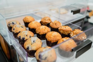 A display case containing muffins.