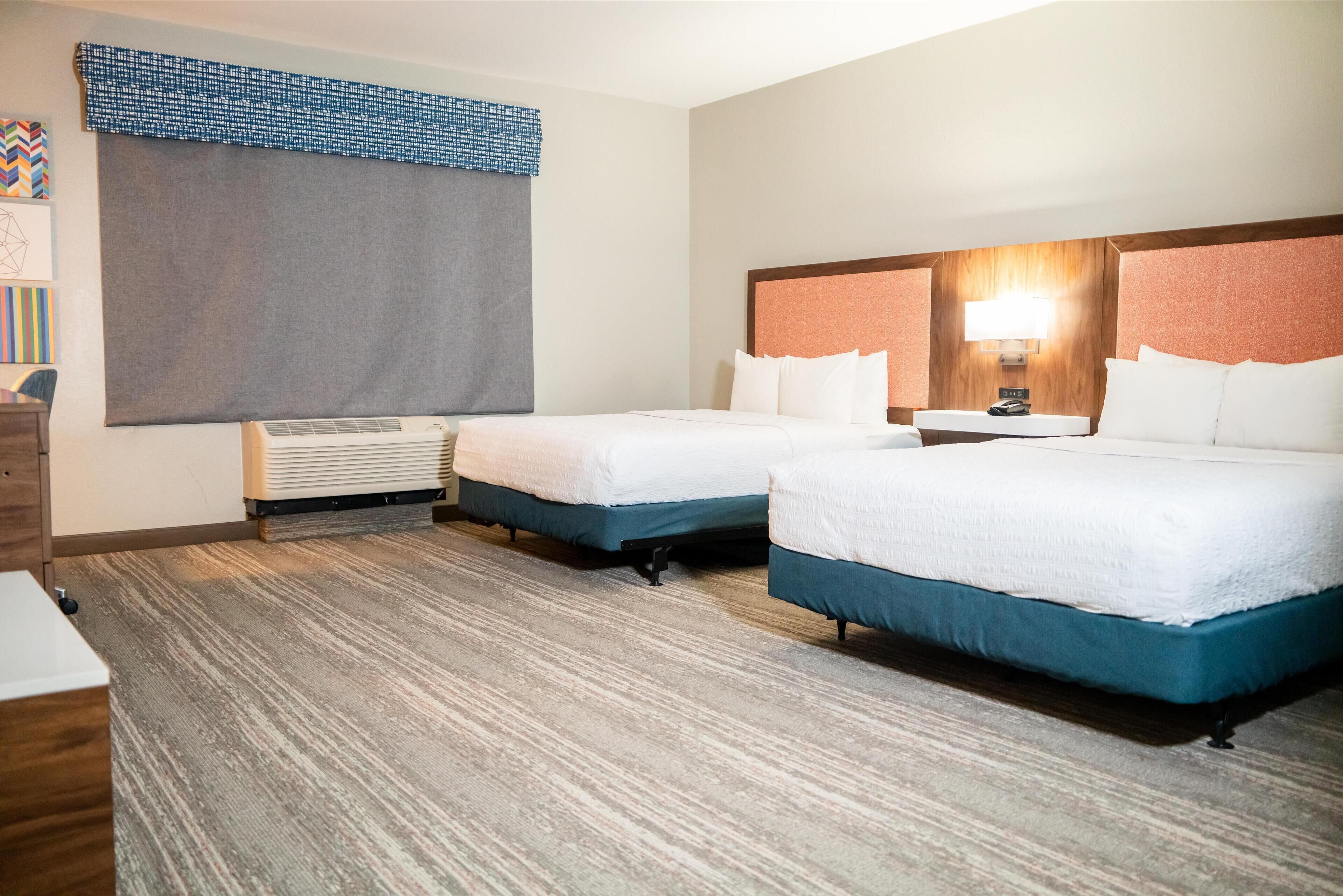 premium bedding, down duvets, pillow-top beds, laptop workspace