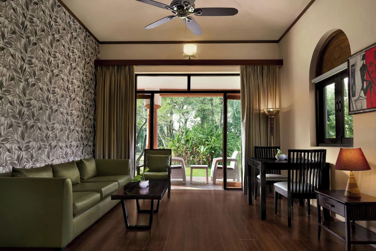 Suite, 1 King Bed, Resort View | Living room | 42-inch LCD TV with cable channels, TV