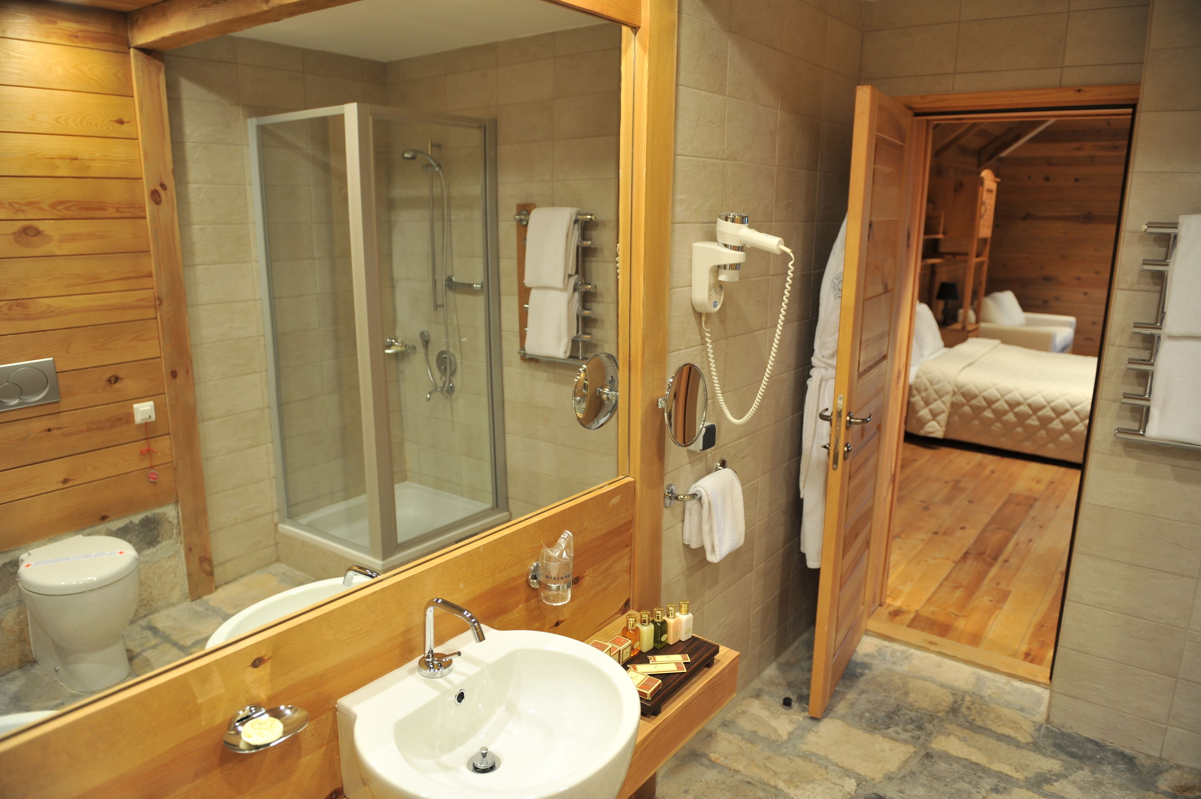 combined shower/bathtub, designer toiletries, hair dryer, bathrobes