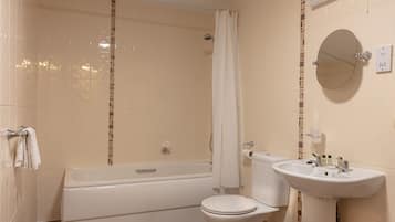 Combined shower/bathtub, designer toiletries, hair dryer, towels