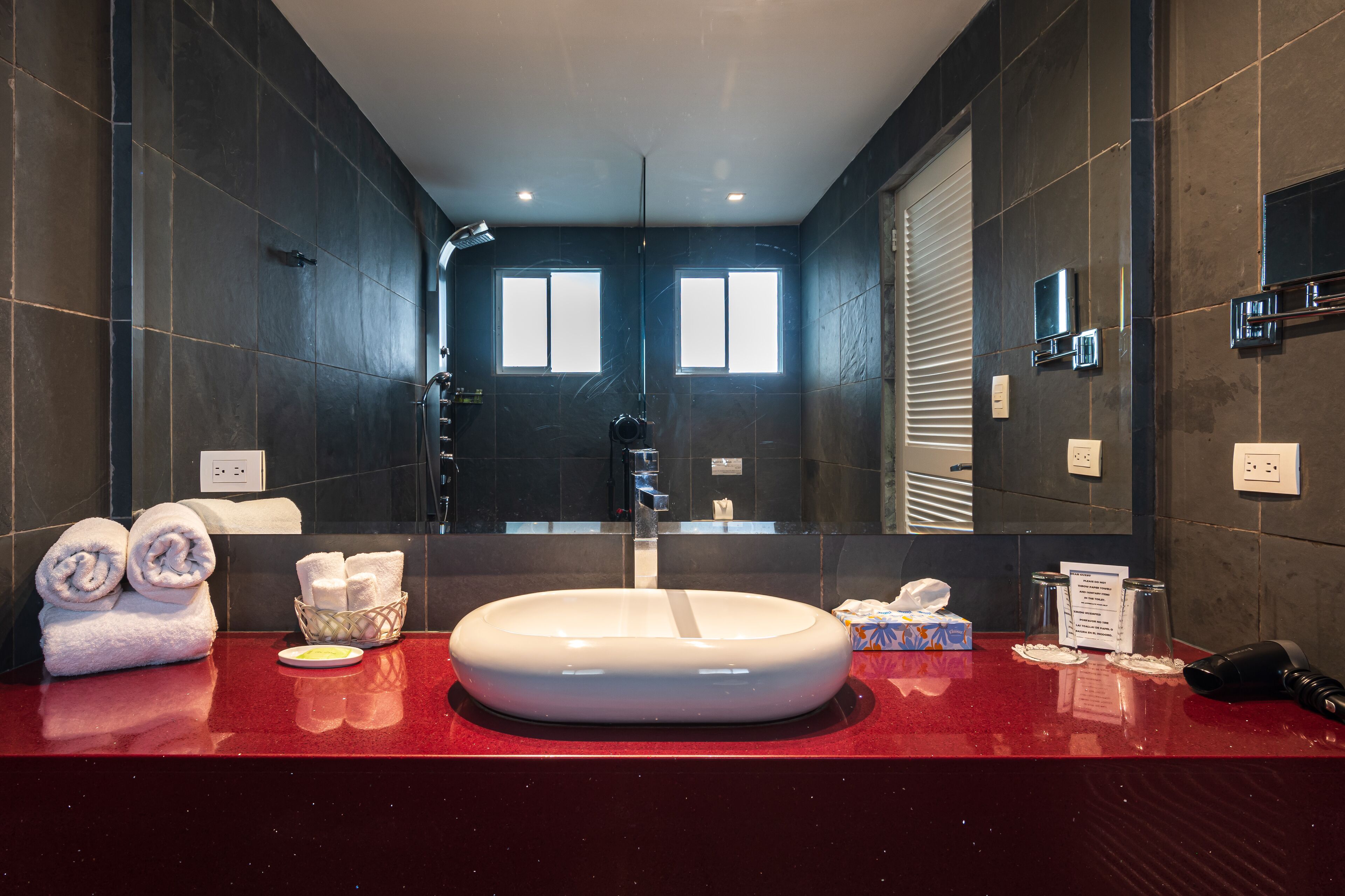 designer toiletries, hair dryer, towels, soap