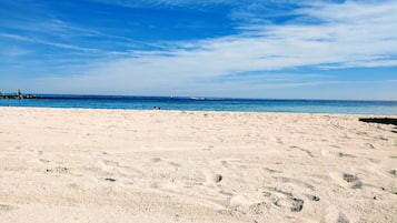 Sun loungers, beach umbrellas, beach towels